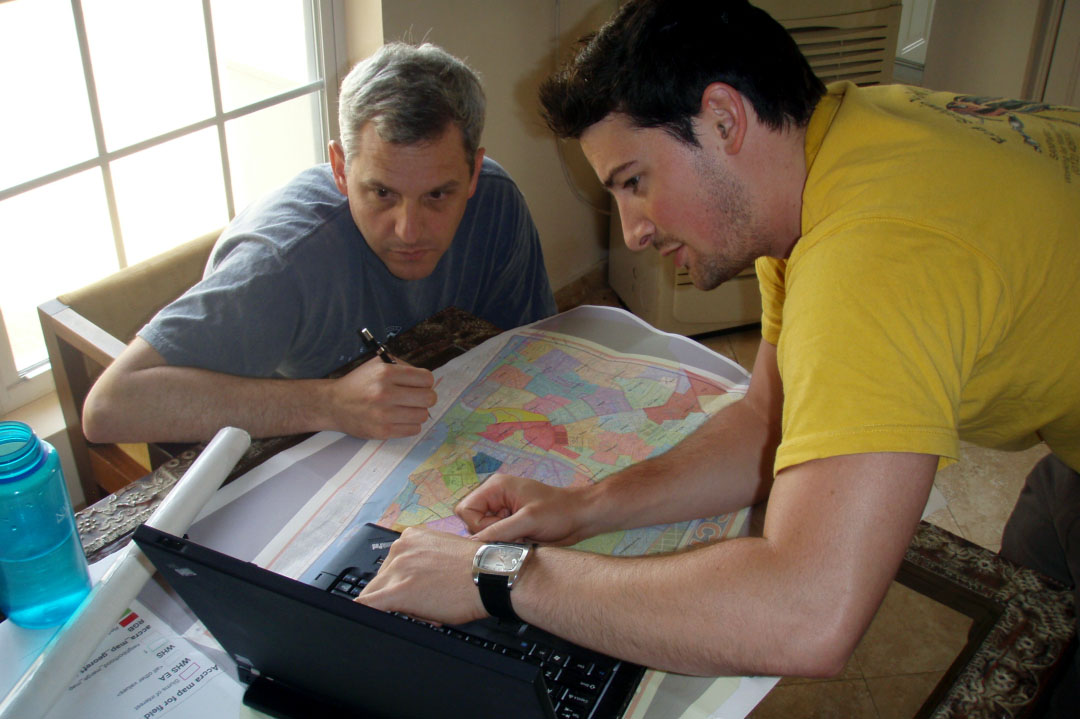 The Center for Urban and Environmental Research's Ryan Engstrom and a colleague poring over a map